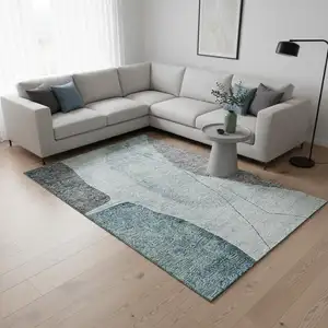 Photo of Teal Gray And Ivory Abstract Washable Area Rug With UV Protection