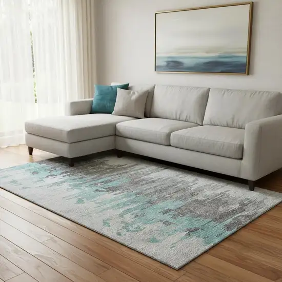 Teal Gray And Ivory Abstract Washable Area Rug With UV Protection Photo 1
