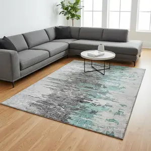 Photo of Teal Gray And Ivory Abstract Washable Area Rug With UV Protection