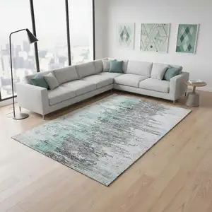 Photo of Teal Gray And Ivory Abstract Washable Area Rug With UV Protection