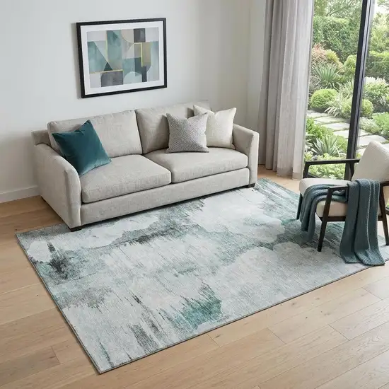 Teal Gray And Ivory Abstract Washable Area Rug With UV Protection Photo 1