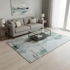 Photo of Teal Gray And Ivory Abstract Washable Area Rug With UV Protection