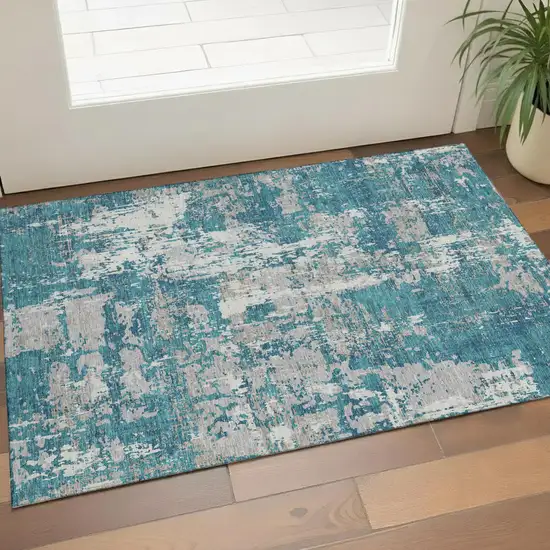 Teal Gray And Ivory Abstract Washable Area Rug With UV Protection Photo 1