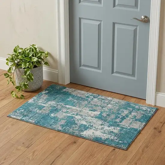 Teal Gray And Ivory Abstract Washable Area Rug With UV Protection Photo 1