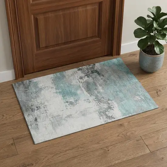 Teal Gray And Ivory Abstract Washable Area Rug With UV Protection Photo 1
