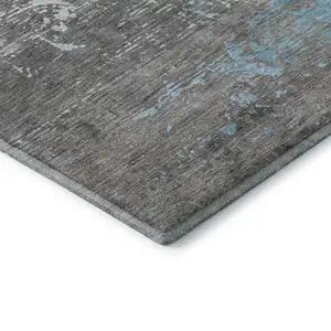 Photo of Teal Gray And Ivory Abstract Washable Area Rug With UV Protection