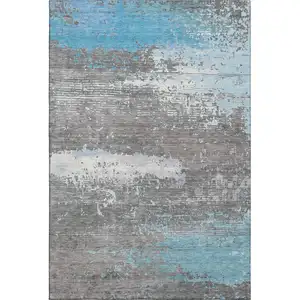 Photo of Teal Gray And Ivory Abstract Washable Area Rug With UV Protection