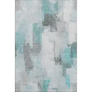 Photo of Teal Gray And Ivory Abstract Washable Area Rug With UV Protection