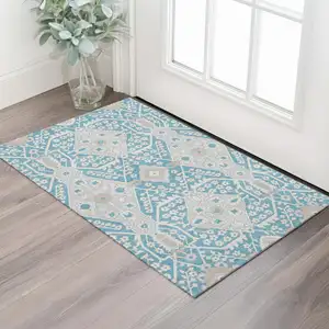 Photo of Teal Gray And Ivory Floral Washable Area Rug With UV Protection