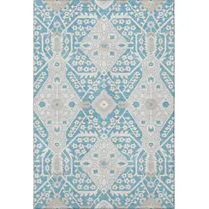 Photo of Teal Gray And Ivory Floral Washable Area Rug With UV Protection