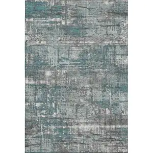 Photo of Teal Gray And Ivory Geometric Washable Area Rug With UV Protection