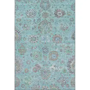 Photo of Teal Gray And Ivory Oriental Washable Area Rug With UV Protection