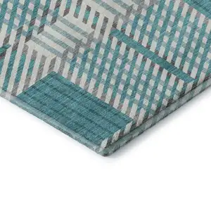 Photo of Teal Gray And Ivory Plaid Washable Area Rug With UV Protection