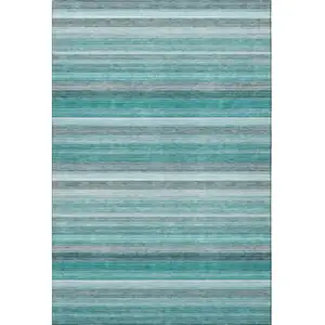 Photo of Teal Gray And Ivory Striped Washable Area Rug With UV Protection
