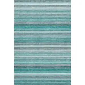 Photo of Teal Gray And Ivory Striped Washable Area Rug With UV Protection