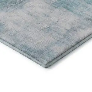 Photo of Teal Gray And Silver Abstract Washable Area Rug With UV Protection