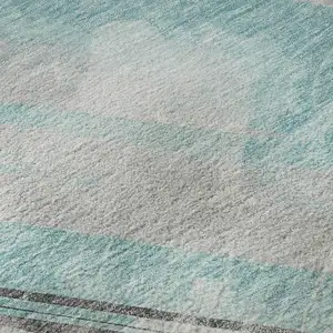 Photo of Teal Gray And Silver Striped Washable Area Rug With UV Protection