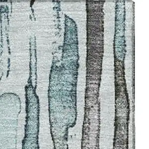 Photo of Teal Gray And Silver Striped Washable Area Rug With UV Protection