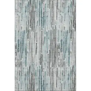 Photo of Teal Gray And Silver Striped Washable Area Rug With UV Protection