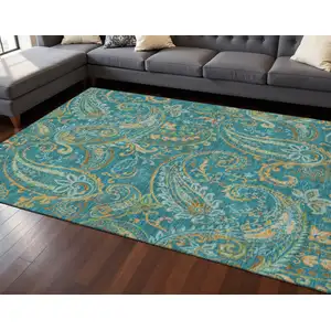 Photo of Teal Green And Gold Paisley Washable Area Rug With UV Protection