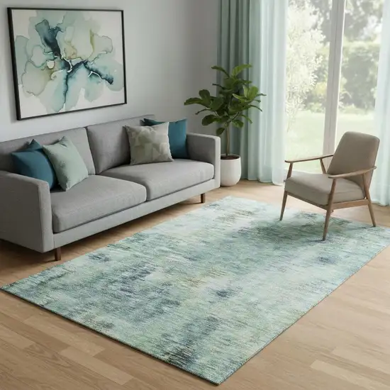 Teal Green And Ivory Abstract Washable Area Rug With UV Protection Photo 1