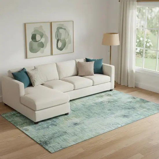 Teal Green And Ivory Abstract Washable Area Rug With UV Protection Photo 1