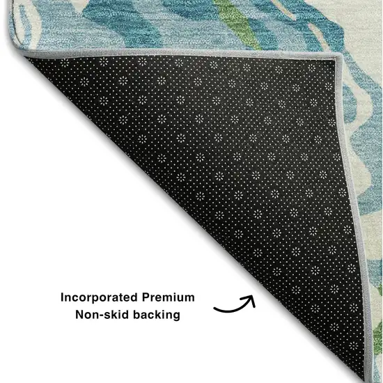 Teal Green And Ivory Abstract Washable Area Rug With UV Protection Photo 6