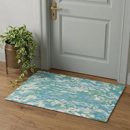 Teal Green And Ivory Abstract Washable Area Rug With UV Protection Photo 1