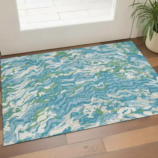 Teal Green And Ivory Abstract Washable Area Rug With UV Protection Photo 1