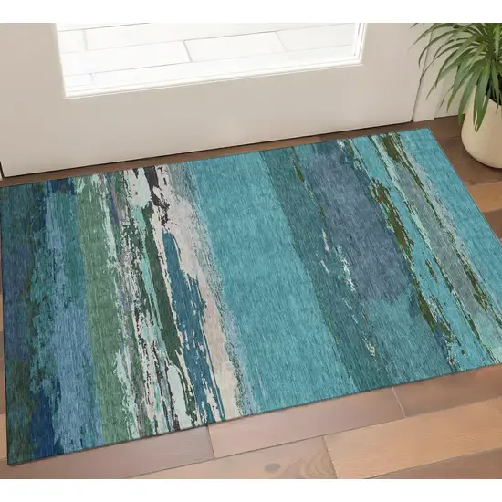 Teal Green And Ivory Abstract Washable Area Rug With UV Protection Photo 1