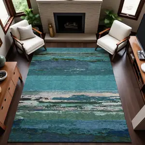 Photo of Teal Green And Ivory Abstract Washable Area Rug With UV Protection
