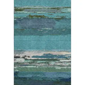 Photo of Teal Green And Ivory Abstract Washable Area Rug With UV Protection