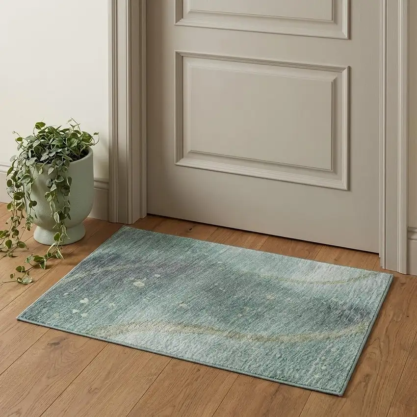 Teal Green And Ivory Abstract Washable Area Rug With UV Protection Photo 1