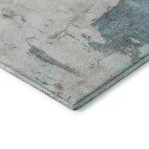 Photo of Teal Green And Ivory Abstract Washable Area Rug With UV Protection