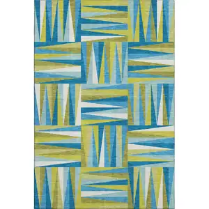 Photo of Teal Green And Ivory Geometric Washable Area Rug With UV Protection