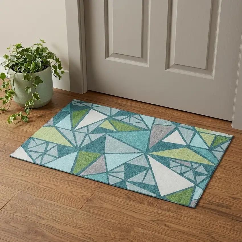 Teal Green And Ivory Geometric Washable Area Rug With UV Protection Photo 1