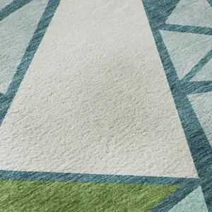 Photo of Teal Green And Ivory Geometric Washable Area Rug With UV Protection