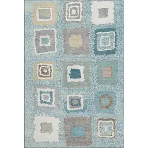 Photo of Teal Ivory And Beige Geometric Washable Area Rug With UV Protection