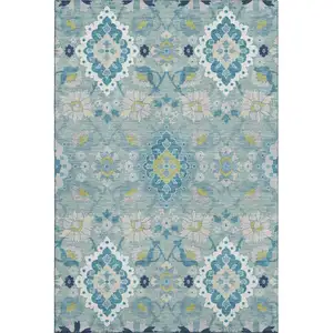 Photo of Teal Ivory And Beige Oriental Washable Area Rug With UV Protection