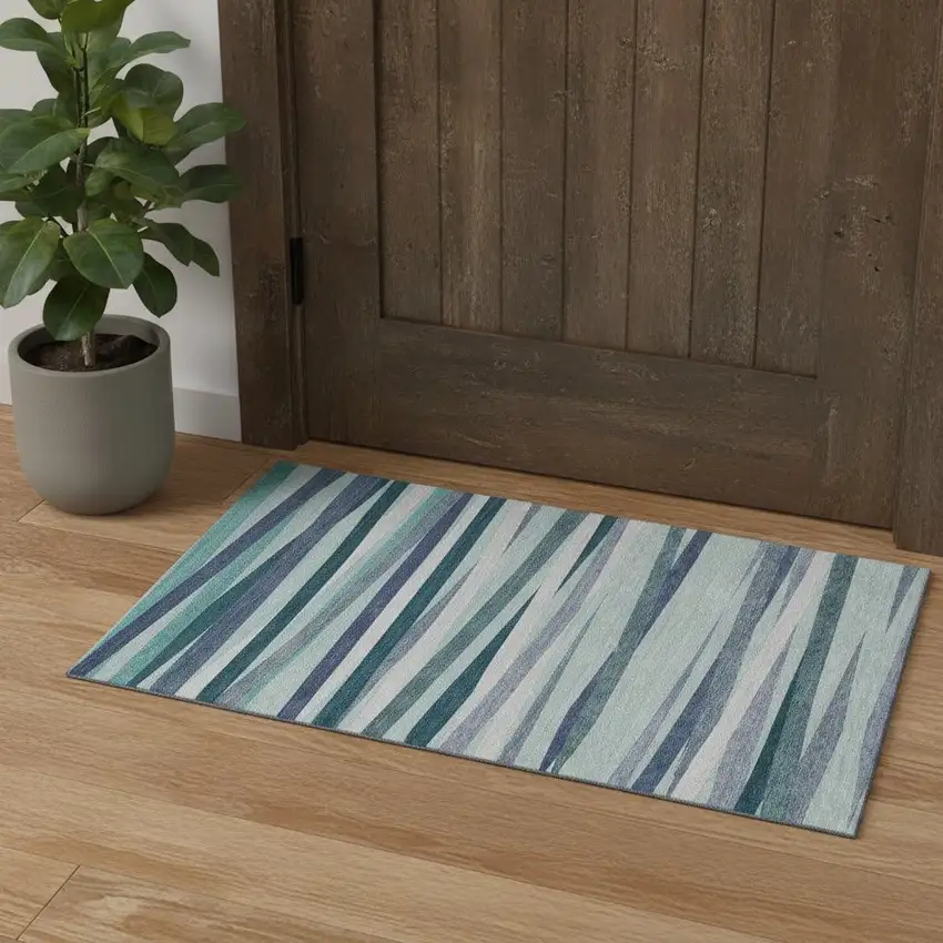 Teal Ivory And Blue Striped Washable Area Rug With UV Protection Photo 1