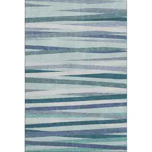 Photo of Teal Ivory And Blue Striped Washable Area Rug With UV Protection