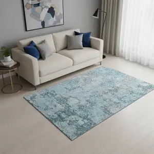 Photo of Teal Ivory And Gray Abstract Washable Area Rug With UV Protection