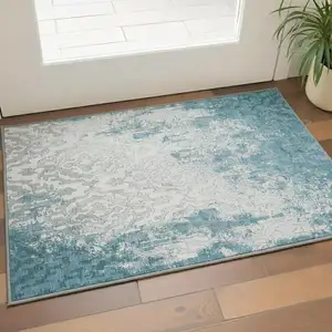 Photo of Teal Ivory And Gray Medallion Washable Area Rug With UV Protection