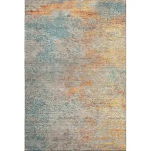 Photo of Teal Peach And Gold Abstract Washable Area Rug With UV Protection