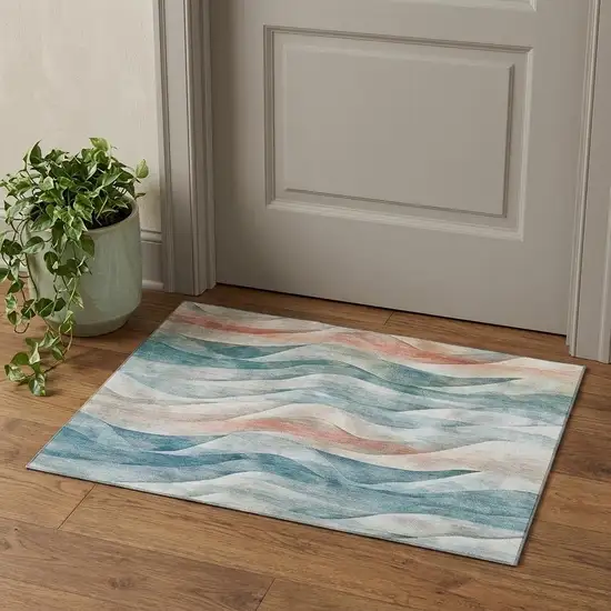 Teal Peach And Ivory Abstract Washable Area Rug With UV Protection Photo 1
