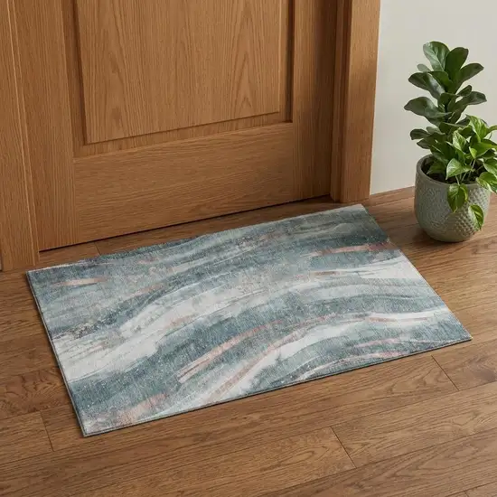 Teal Peach And Ivory Abstract Washable Area Rug With UV Protection Photo 1