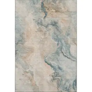 Photo of Teal Peach And Ivory Abstract Washable Area Rug With UV Protection