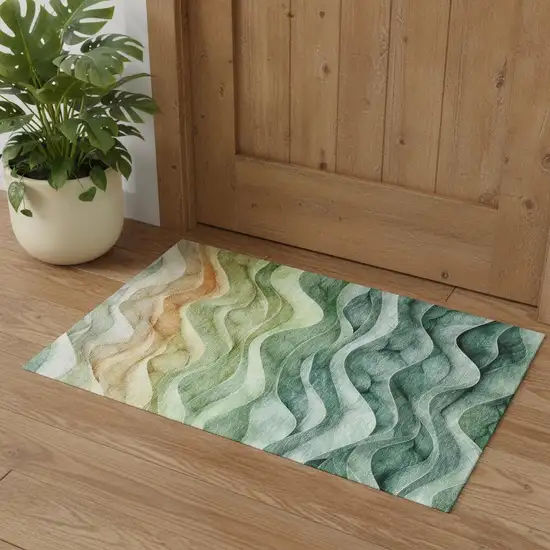 Teal Peach And Lime Green Abstract Washable Area Rug With UV Protection Photo 1