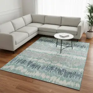 Photo of Teal Silver And Gray Striped Washable Area Rug With UV Protection