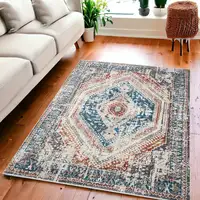 Photo of Teal Taupe and Rust Geometric Distressed Area Rug With Fringe